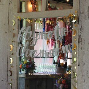 "Fly me to the moon" and "Written in the Stars" Signs